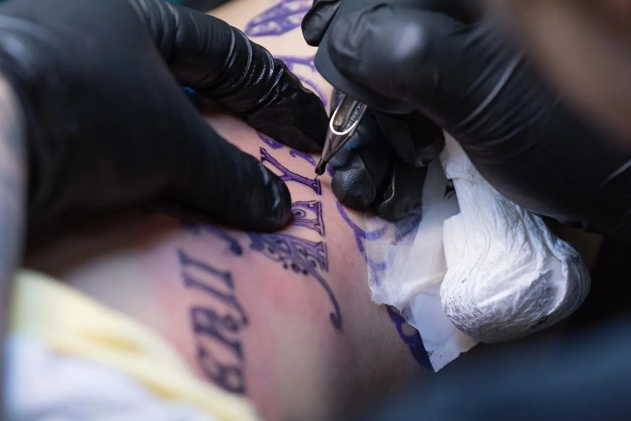 DietschVision artist tattooing a client