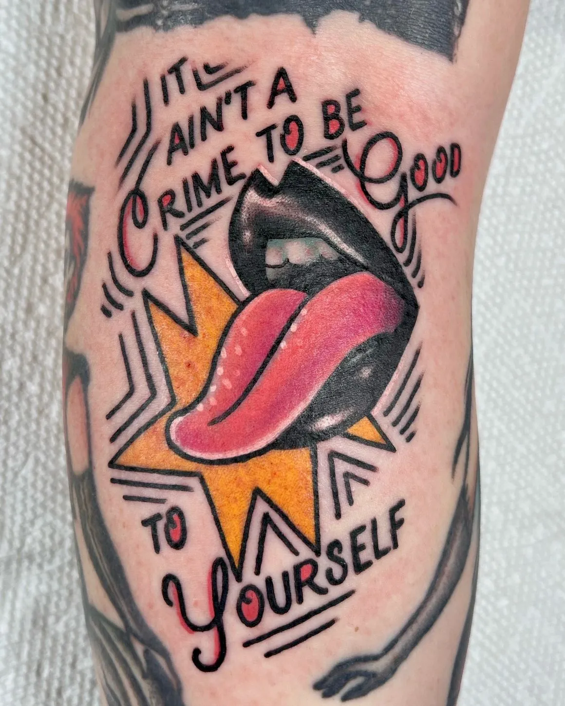 Traditional lettering and lips tattoo
