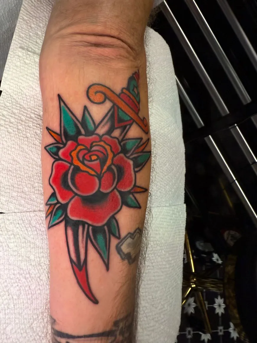Color roses forearm tattoo