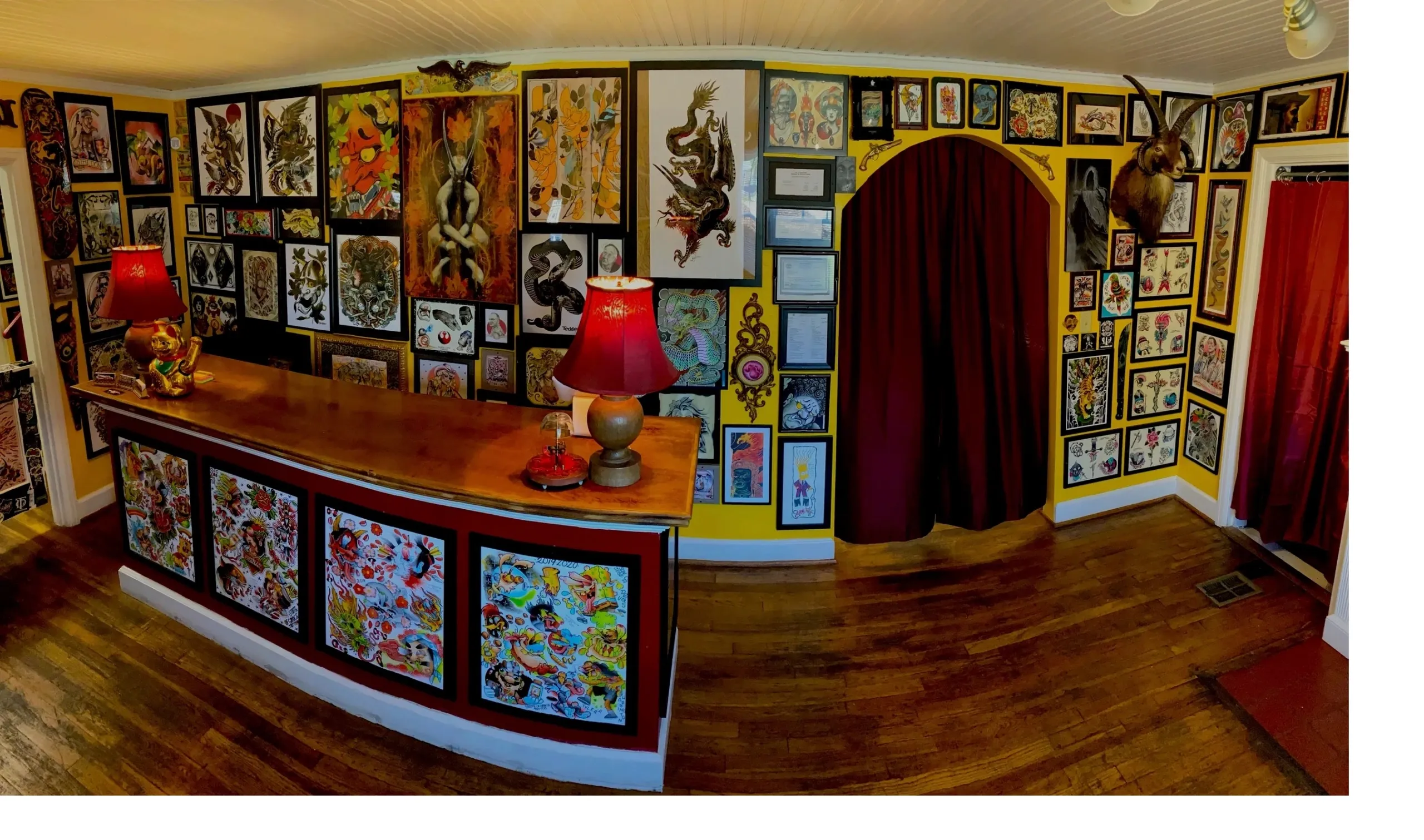 Inside DietschVision Tattoo Gallery, walls covered in framed tattoo flash
